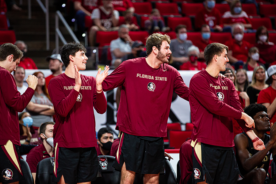 Prieto, center, supporting teammates at North Carolina State University. Courtesy photo.