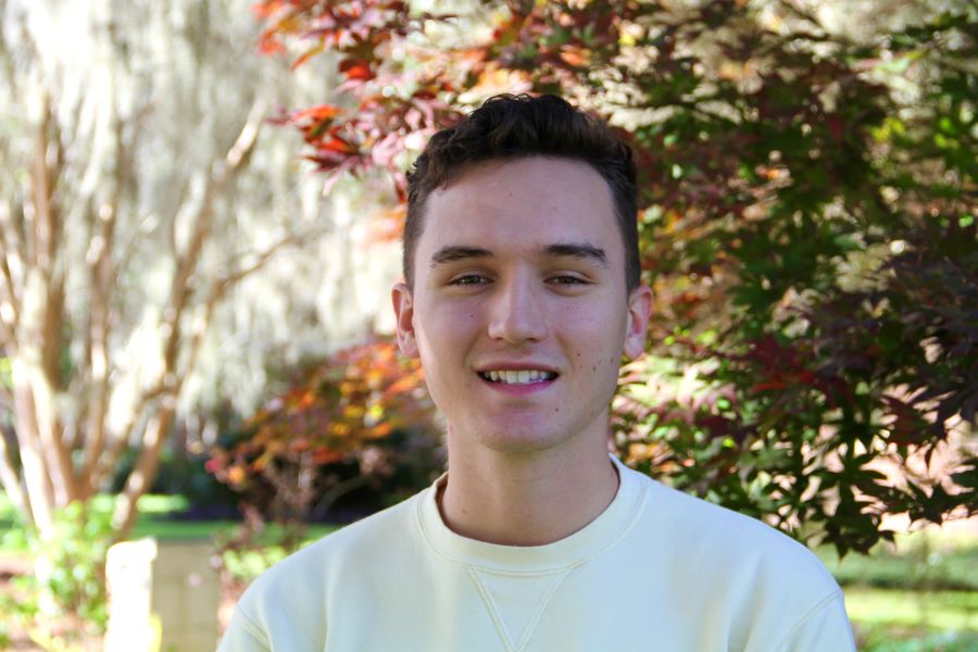 A headshot of Dylan Gire standing outside. 