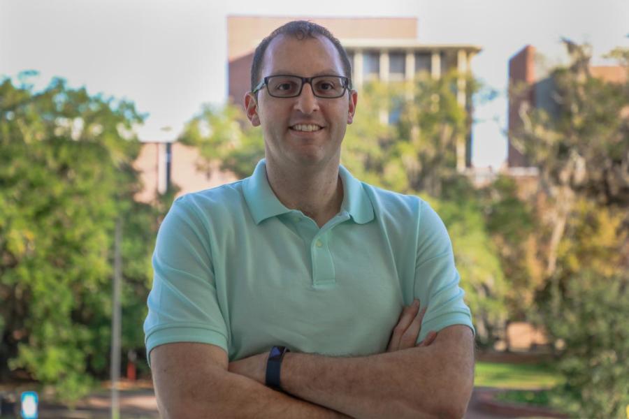 Assistant professor of biological science Douglas Storace standing outside on FSU's campus.