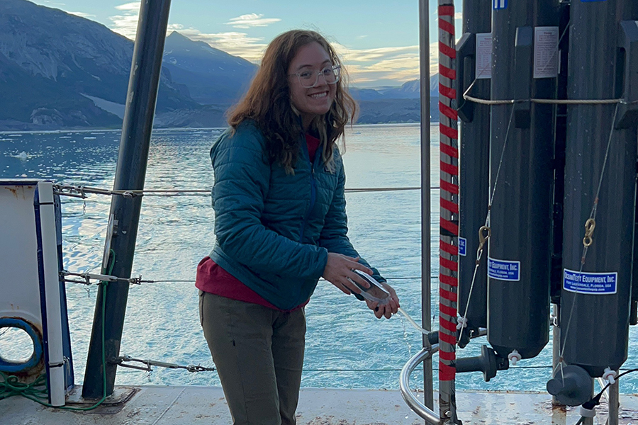 Andrea Emmanuelli next to conductivity-temperature-depth sensors, which are used to study water properties like oxygen saturation and salinity. Photo courtesy Andrea Emmanuelli.