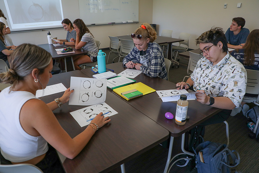 Students participate during one of professor Carolina Gonzalez's courses in FSU's Linguistics Program. Photo by Devin Bittner.