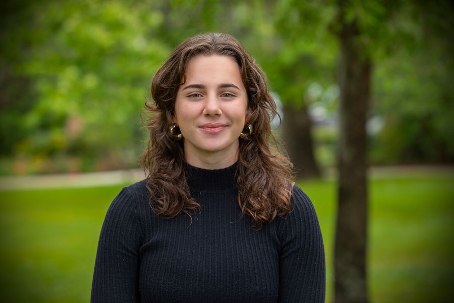 Headshot of Sydney Cole smiling.