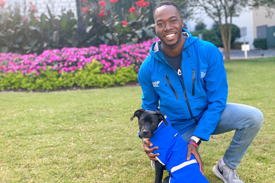Tevin Wooten and his dog, Radar, prepare for rainfall. Courtesy photo.