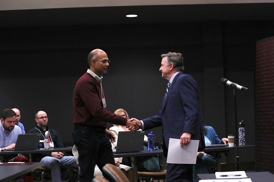 Professor Vasu Misra greets FSU President Richard McCullough.