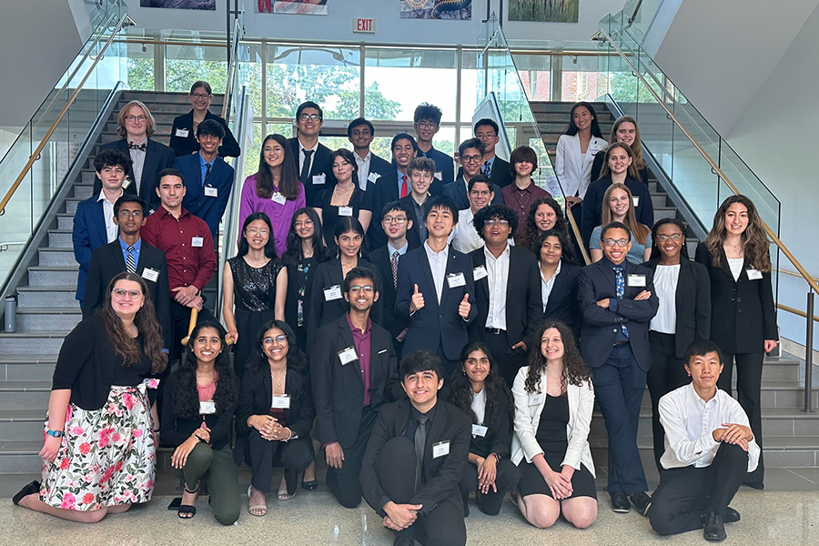 Young Scholars Program students gather after presenting their research to university faculty and students. Courtesy photo.