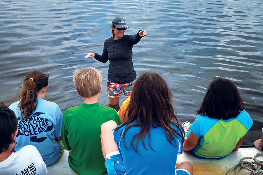 Barbara Shoplock educates students while out on the water at Saturday-at-the-Sea. Courtesy photo.
