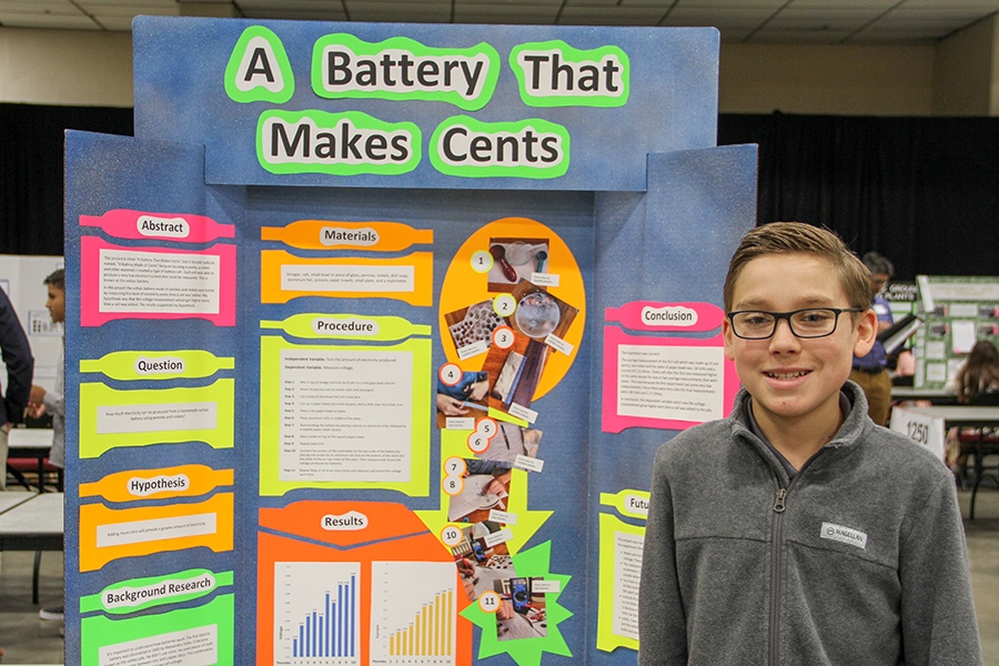 A student poses with their poster board at the 2023 Capital Regional Science Fair. Courtesy photo.
