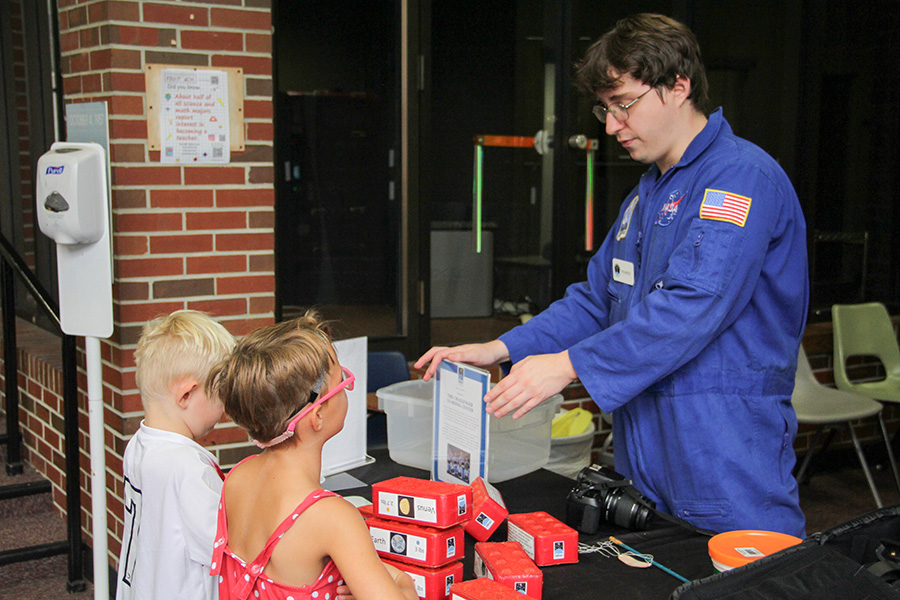 Young students participate in hands-on activities at the Saturday Morning Physics "Tour of the Universe" event on Oct. 5.