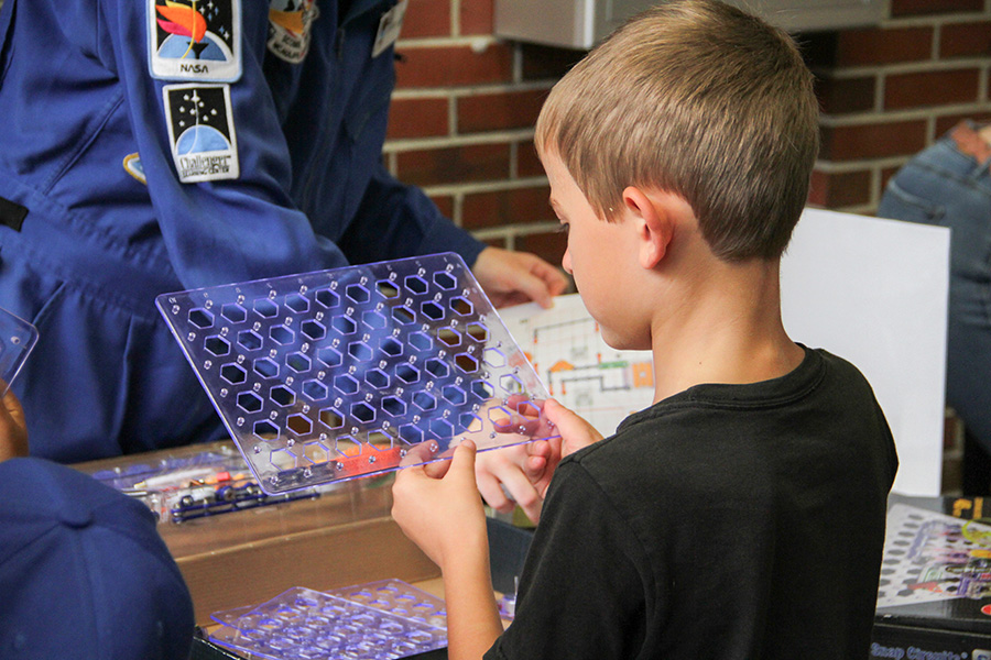 Young students participate in hands-on activities at the Saturday Morning Physics "Tour of the Universe" event on Oct. 5.