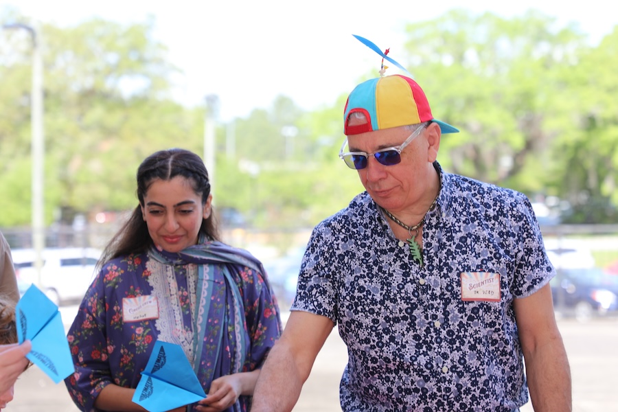 Physics doctoral student Mehak Ghafoor (left) and professor of physics Vladimir Dobrosavljevic (right) prepare for Physics Phlyer, the ultimate paper airplane contest. Photo by Kendall Cooper.