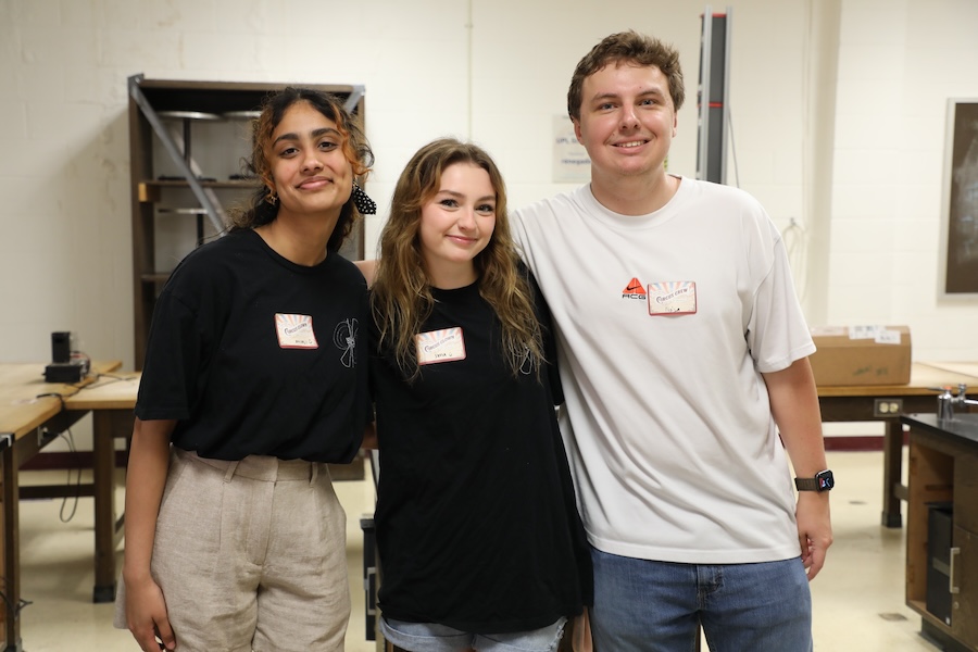 Undergraduates (from left to right) Anjali Mital, Sofia Jolley, and Nolan Scales manned several laboratory demonstrations — including that of a Mendocino motor — and are just a few of the many undergraduate and graduate students who helped make this year's Circus of Physics a success. Photo by Kendall Cooper.