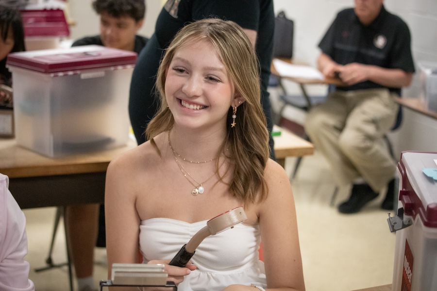 Middle school students use Geiger counters, a device for measuring the presence and frequency of radiation, to study how gamma rays are adsorbed in a variety of materials. Photo by Devin Bittner.