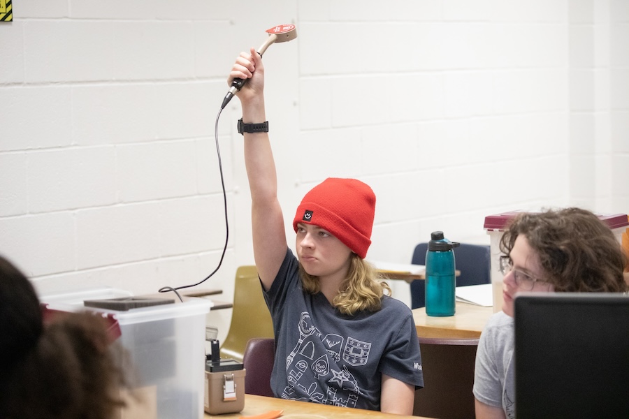 Middle school students use Geiger counters, a device for measuring the presence and frequency of radiation, to study how gamma rays are adsorbed in a variety of materials. Photo by Devin Bittner.