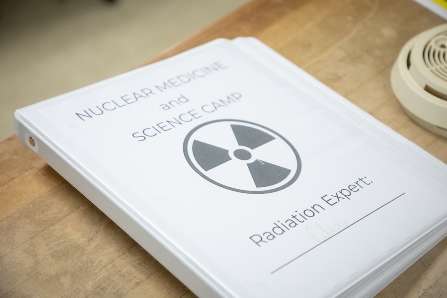 Students record their scientific findings during the Nuclear Medicine and Science Camp. Photo by Devin Bittner.