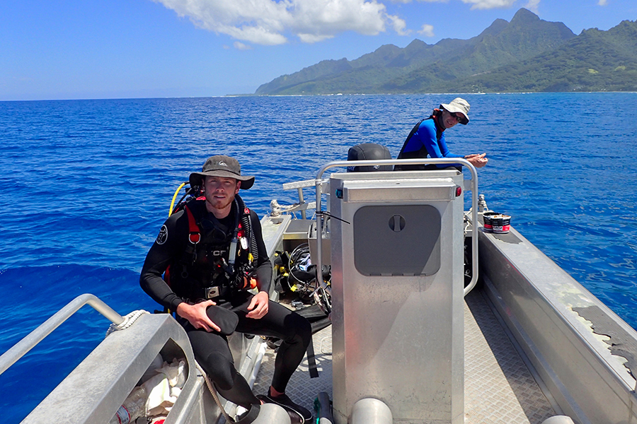 Diving Safety Officer Chris Peters prepares for a dive with professor Peter Edmunds of California State University Northridge during a project in Moorea, French Polynesia. Photo by Scott Burgess.