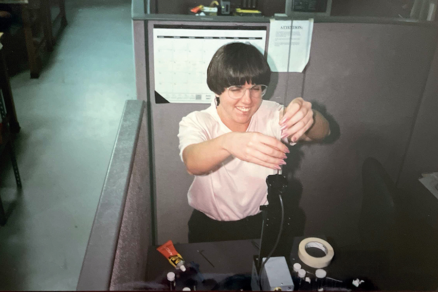 Kathleen Amm puts a sample into a SQUID magnetometer in Zack Fisk's lab at the National High Magnetic Field Laboratory during her time as a student. Courtesy photo.