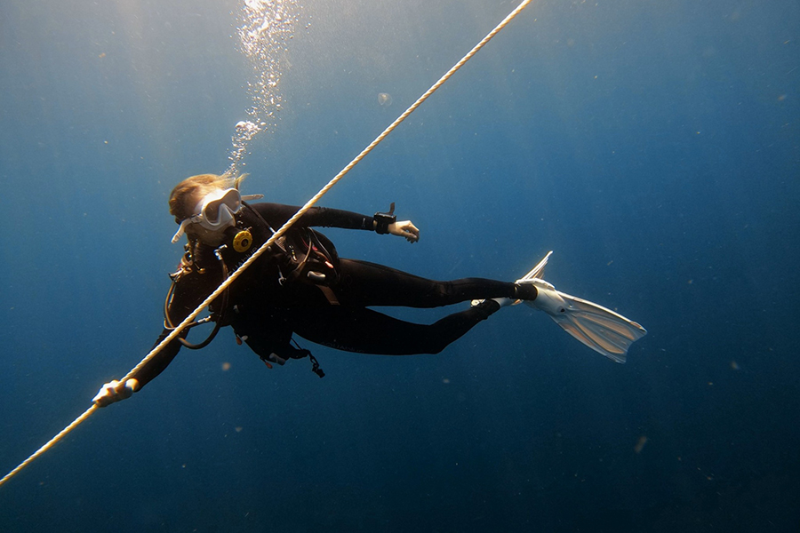 FSU Coastal and Marine Laboratory Diving Scholarship recipient and graduate student Lillie Bradshaw ascends while assisting an operation supporting an artificial reef deployment. Photo by Eli Myron.