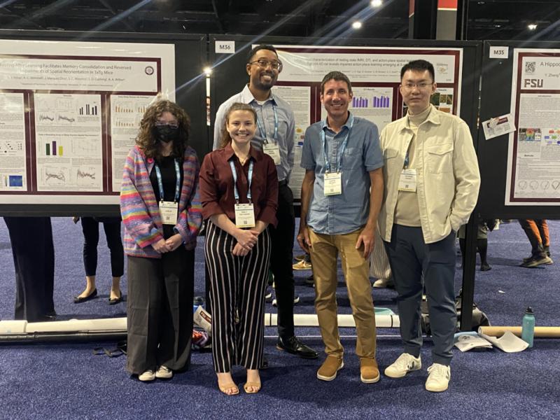 Wilber Lab members present their research on the relationship between spatial navigation and spatial memory at the 2024 Society for Neuroscience Conference in Chicago, Illinois. From left: Leslie Alday, Emily Salvador, Khari Hardin, associate professor of psychology Aaron Wilber and Yicheng Zheng. Courtesy photo.