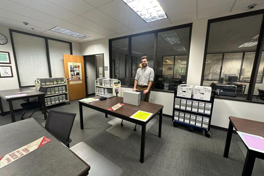 Dean Michel working in the National Archives at Riverside in Perris, California, which contains the Bureau of Indian Affairs records for the Colorado River Indian District during the late 19th and 20th centuries. The bureau includes land surveys, allotments, enrollment records, and records from local and state-level administrators. Courtesy photo.