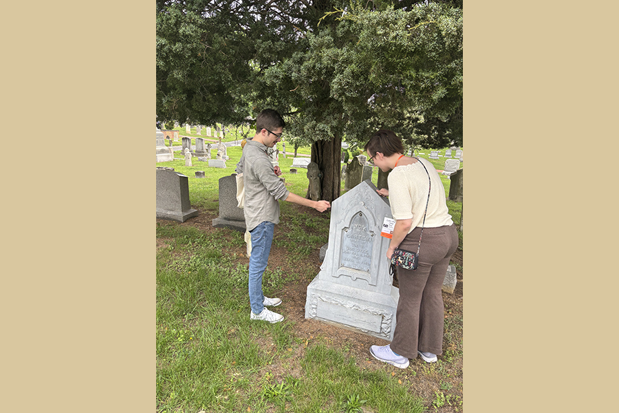 Camp and MacKinlay examine a gravestone by knocking on it to determine its material in Wilmington, Delaware, as a part of their site visits during the conference. Zinc gravestones became widely popular during this period due to salesmen traveling the country via railroad. Courtesy Photo.