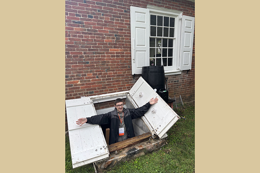 MacKinlay exits the cellar of the Appoquinimink Quaker Meetinghouse, Delaware, as part of site visits related to the Vernacular Architecture Forum annual conference in May 2025. Courtesy Photo.