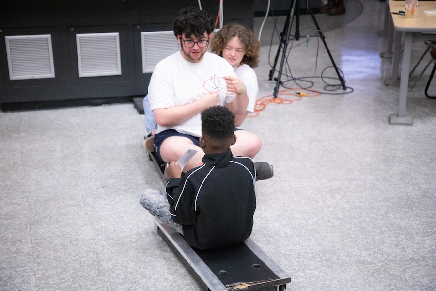 Students participate in the Saturday Morning Physics event on Oct. 11, titled "Unlocking the Secrets of the Universe: A Fun Adventure into Classical Physics!"