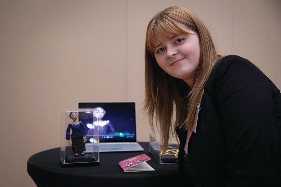 Raven Watkins presents her project at the 2025 President’s Showcase of Undergraduate Research Excellence. 
