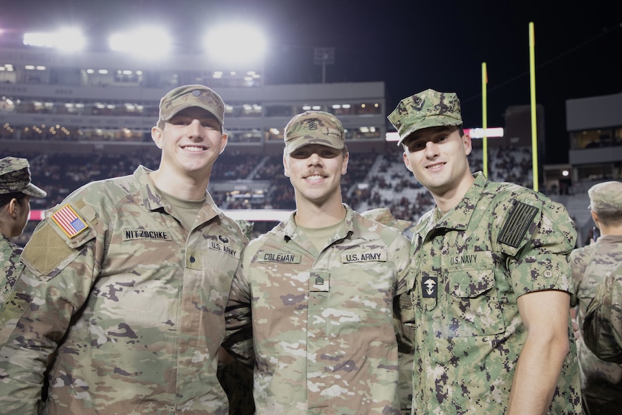 Members of FSU's Army ROTC and Florida A&M University's Navy ROTC pose for a photo at the Military Appreciation Game. Photo by Bella Bozied.