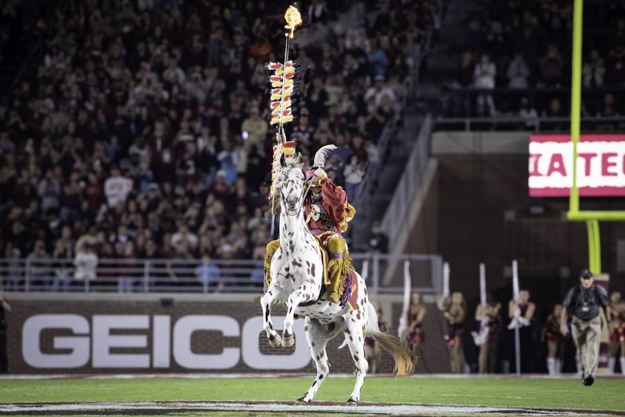 Osceola and Renegade plant the flaming spear midfield to mark the start of the 2025 Military Appreciation Game. Photo by Carly Nelson.
