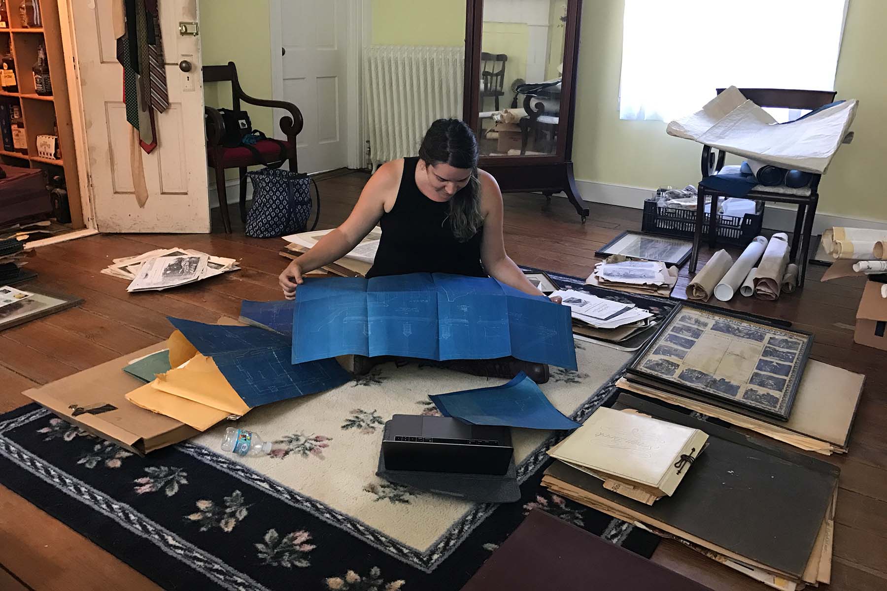 Kathleen Powers Conti examines historic blueprints. (Bryn Davis)