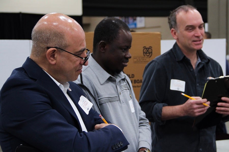 Judges listen to students' presentations and take notes at the 2026 Capital Regional Science and Engineering Fair Feb. 13 in Tallahassee, Florida. Photo by Bella Bozied.