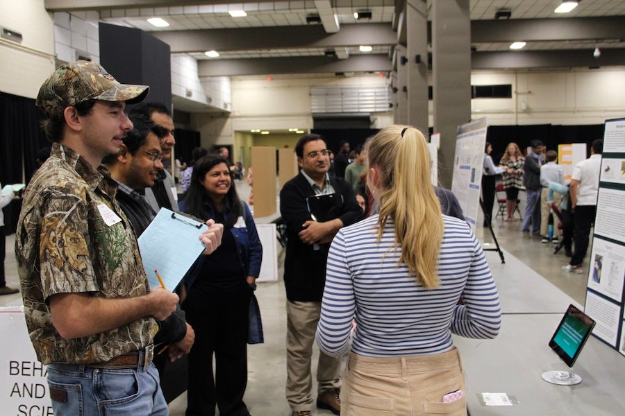 Judges speak with a student at the 2026 Capital Regional Science and Engineering Fair Feb. 13 in Tallahassee, Florida. Photo by Bella Bozied.