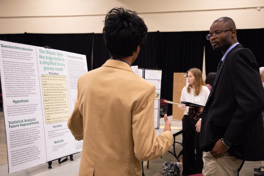 A student discusses their poster with a judge at the 2026 Capital Regional Science and Engineering Fair Feb. 13 in Tallahassee, Florida. Photo by Éabha Phelan.