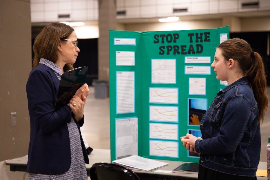 A student discusses their poster with a judge at the 2026 Capital Regional Science and Engineering Fair Feb. 13 in Tallahassee, Florida. Photo by Éabha Phelan.