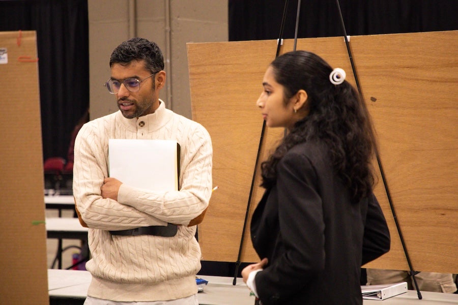 A student discusses their poster with a judge at the 2026 Capital Regional Science and Engineering Fair Feb. 13 in Tallahassee, Florida. Photo by Éabha Phelan.