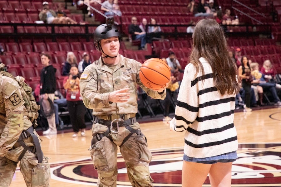 FSU Army ROTC cadets present the game ball following a rappelling demonstration at the FSU Women's Basketball game on Feb. 19, 2026 at the Donald L. Tucker Civic Center in Tallahassee, Florida. Photo by Éabha Phelan.