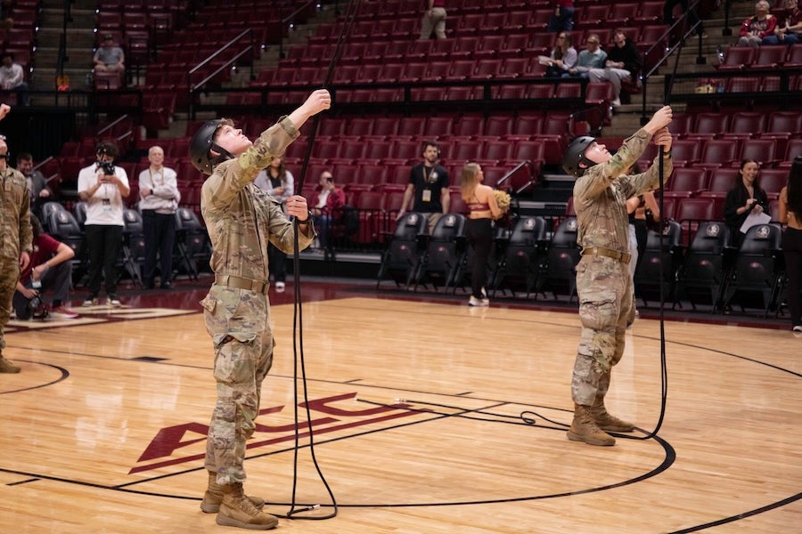 FSU Army ROTC cadets steady their ropes as part in a rappelling demonstration at the FSU Men's Basketball game on Feb. 17, 2026 at the Donald L. Tucker Civic Center in Tallahassee, Florida. Photo by Jack LaBruno.
