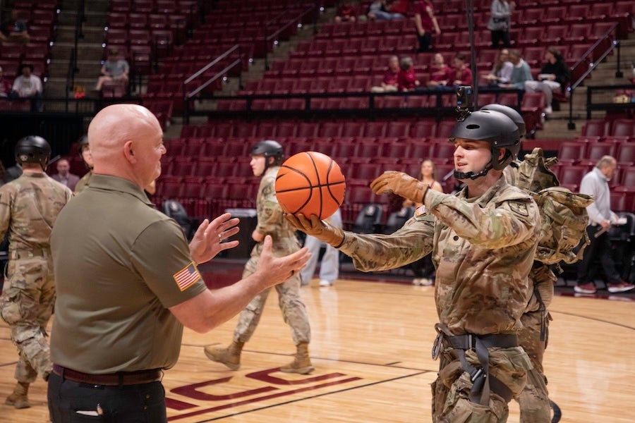 FSU Army ROTC cadets present the game ball following a rappelling demonstration at the FSU Men's Basketball game on Feb. 17, 2026 at the Donald L. Tucker Civic Center in Tallahassee, Florida. Photo by Jack LaBruno.