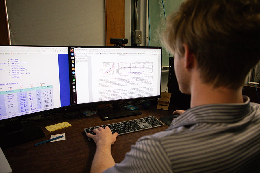 Graduate student Bryan Kelly works at a computer. (Devin Bittner/FSU College of Arts and Sciences)
