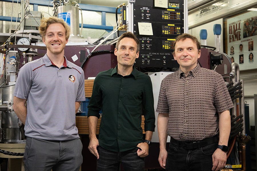 From left, graduate student Bryan Kelly, Associate Professor Mark Spieker and Professor Alexander Volya in the John D. Fox Superconducting Linear Accelerator Laboratory at Florida State University. (Devin Bittner/ FSU College of Arts and Sciences)