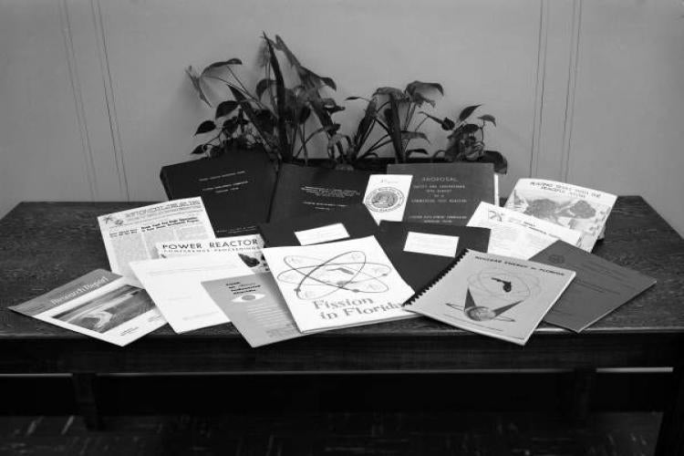 Nuclear physics program materials on a table