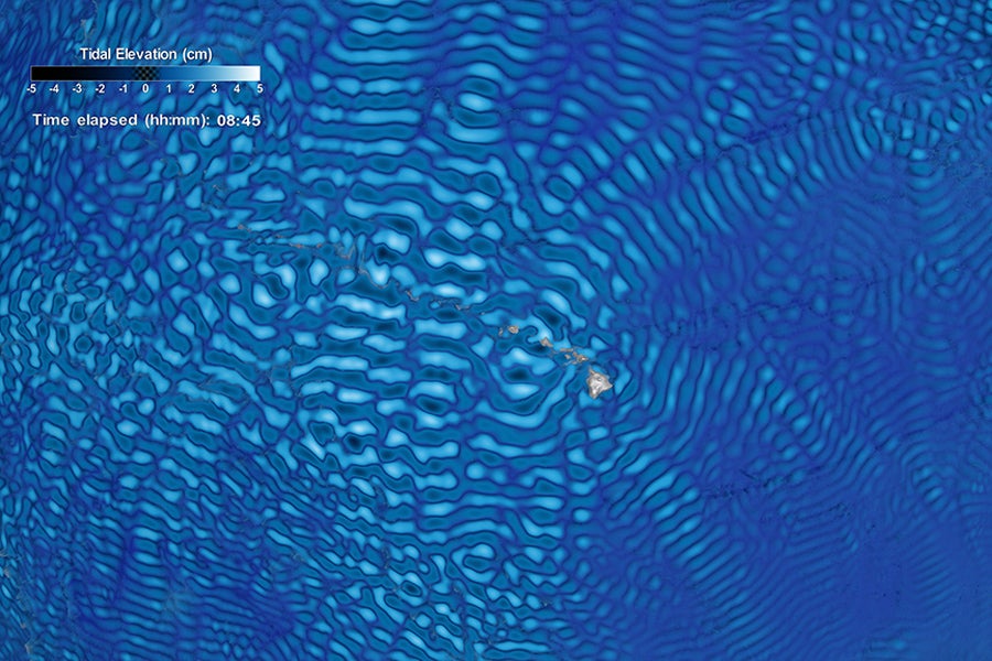 A data visualization showing internal tides data around the Hawaiian Islands from NASA Goddard's Space Flight Center simulation run. Internal tides data appear on the water surface and the direction of the waves reveal the interplay between the steep underwater features and the tidal energy generated in the region. (Courtesy of NASA)
