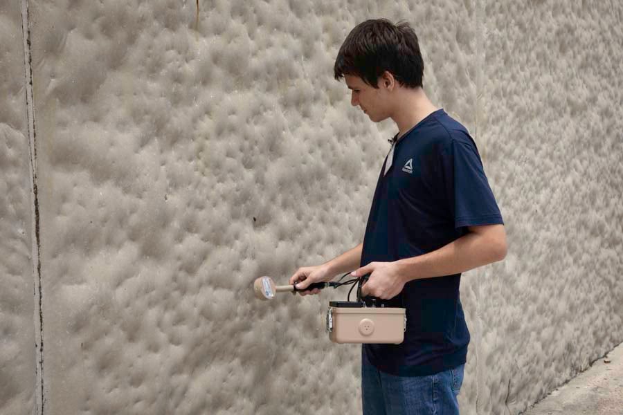 A student holds a Geiger counter up to various surfaces during the 2026 Nuclear Medicine and Science Camp at Mosley High School in Lynn Haven, Florida. Photo by Carly Nelson.