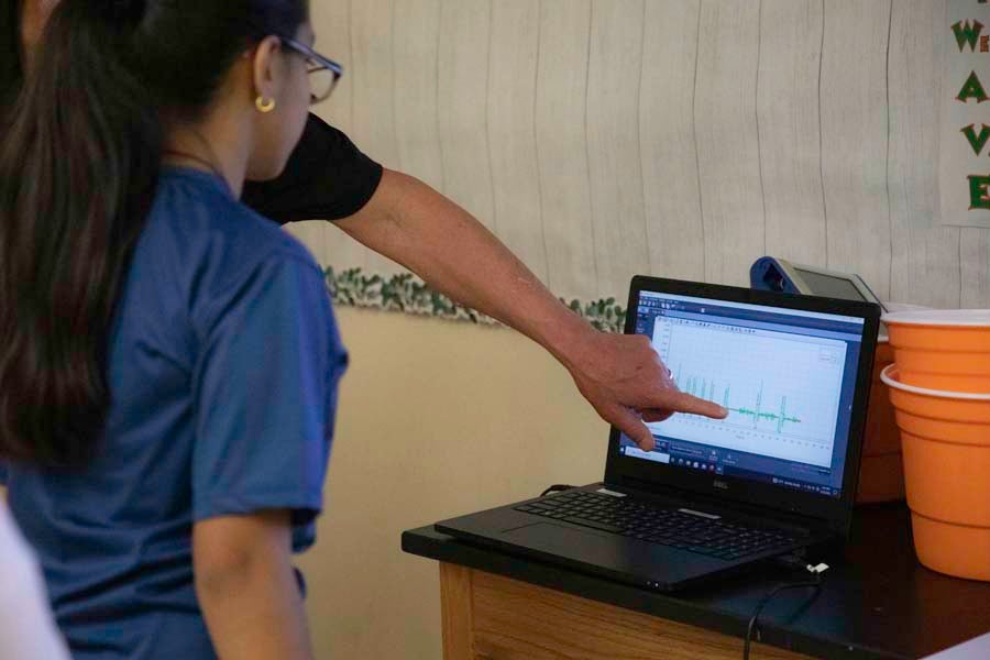 FSU Department of Physics Chair Paul Cottle explains a graph to a student during the 2026 Nuclear Medicine and Science Camp at Mosley High School in Lynn Haven, Florida. Photo by Carly Nelson. 