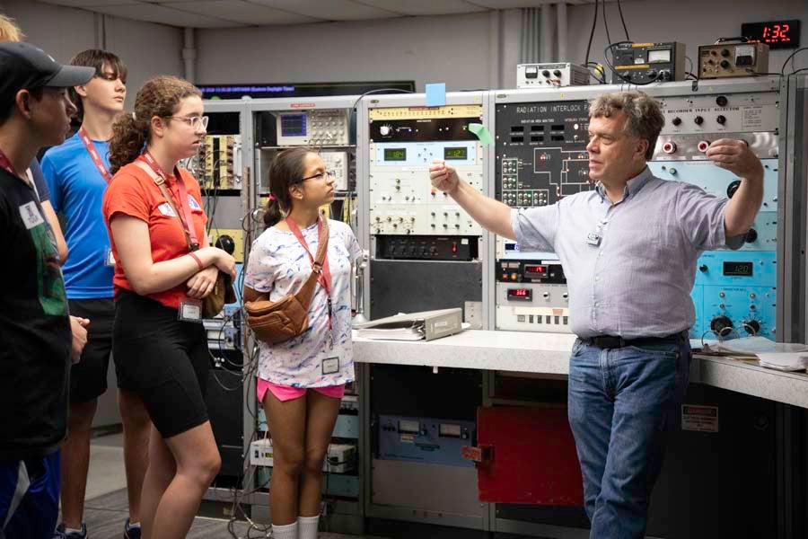 Professor Ingo Wiedenhoever leads students on a tour of the John D. Fox Superconducting Linear Accelerator Laboratory at Florida State University as part of the 2026 Nuclear Medicine and Science Camp. Photo by Carly Nelson.