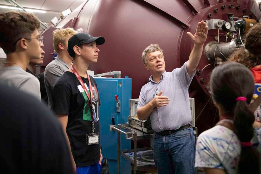 Professor Ingo Wiedenhoever leads students on a tour of the John D. Fox Superconducting Linear Accelerator Laboratory at Florida State University as part of the 2026 Nuclear Medicine and Science Camp. Photo by Carly Nelson.