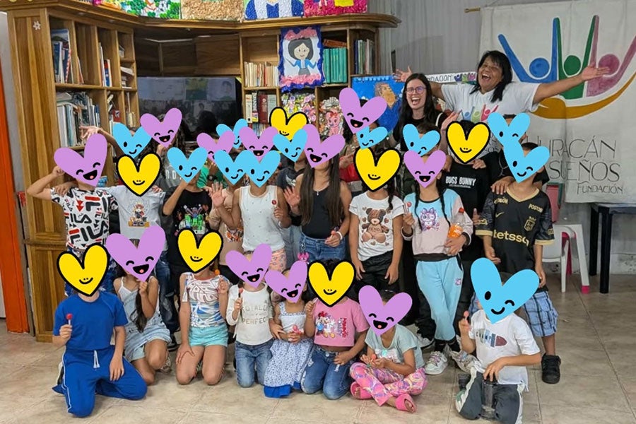 Amelia Rivers, a recent graduate of the College of Music, volunteering with the Huracán de Sueños foundation. Led by Patricia Garcia, the foundation provides after-school activities to underprivileged children in the area
