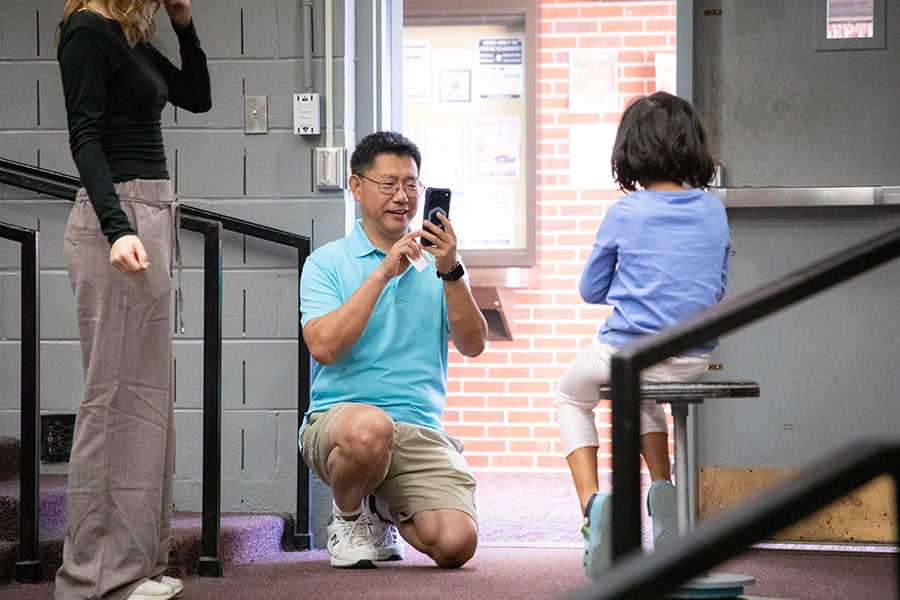 A student sits on a spinning stool during a demonstration as part of a Saturday Morning Physics event hosted by the Society of Physics Students at Florida State University on Oct. 11, 2025. Photo by Carly Nelson.