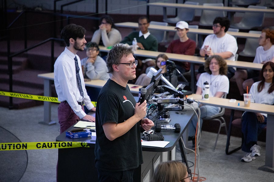A faculty member speaks to attendees during a Saturday Morning Physics event hosted by the Society of Physics Students at Florida State University on Oct. 11, 2025. Photo by Carly Nelson.