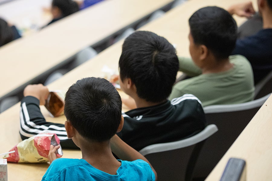 A group of students listen and eat snacks during a demonstration at a Saturday Morning Physics event at Florida State University on Oct. 18, 2025. Photo by Carly Nelson.